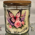 Candle in a glass jar with a butterfly and floral design, labeled 'Happy Mother's Day'.