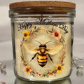 Glass jar with cork lid featuring a bee illustration and 'Happy Mother's Day' text on a white background.